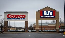Costco and BJs store signs next to each other